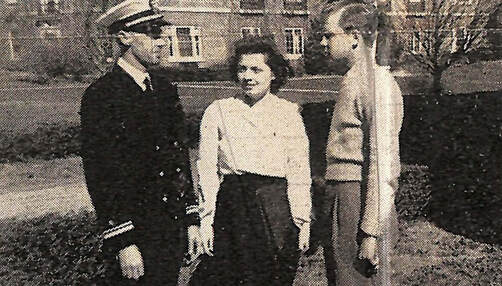 Navy chaplain Clifford Madsen and two students in front of Dana College, WWII.