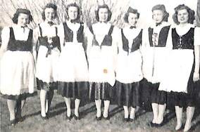 Female students from Dana College perform in Danish-style folk costumes in 1944. 